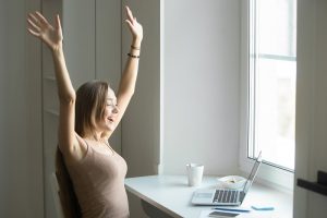 Profile portrait of a woman celebrating writing a blog post